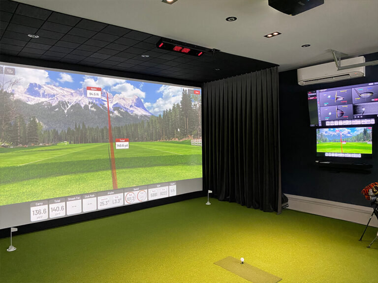 Luxury garage golf simulator with mini-split AC installation and SkyTrak launch monitor in Clearwater, FL.