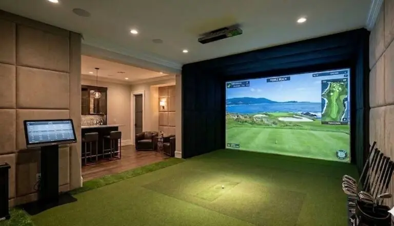 Professional indoor golf simulator installation by Sims & Greens featuring a high-impact screen and custom hitting mat in a luxury Florida home.